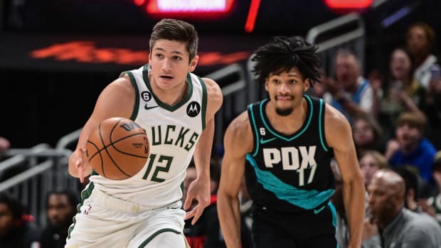 Milwaukee Bucks guard Grayson Allen (12) drives for the basket against Portland Trail Blazers guard Shaedon Sharpe (17)